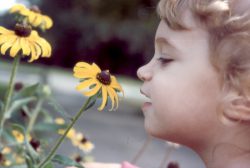 Chloe smelling flower again