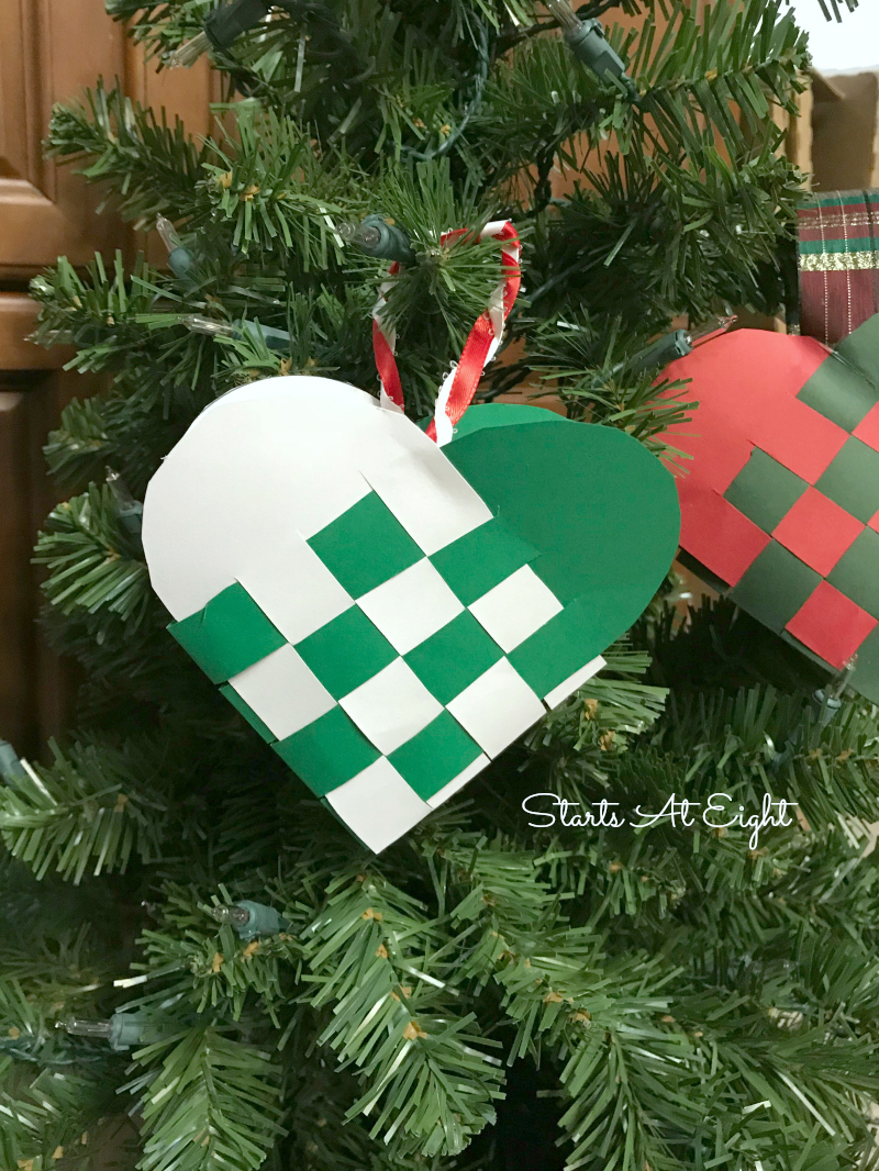 Christmas Crafts: Swedish Woven Heart Paper Craft Tutorial. Grab some card stock, ribbon, scissors, and glue to craft a woven heart basket or ornament. from Starts At Eight