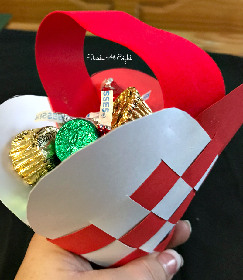 Christmas Crafts: Swedish Woven Heart Paper Craft Tutorial. Grab some card stock, ribbon, scissors, and glue to craft a woven heart basket or ornament. from Starts At Eight