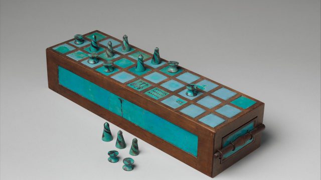 Restored wood and faience senet board and game pieces from the 18th Dynasty now in the Metropolitan Museum of Art. Metropolitan Museum.